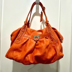 Aqua Maddonna Orange Leather handbag w/leopard lining. In excellent condition.